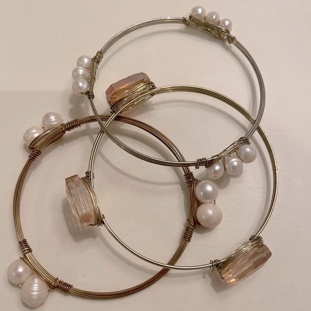 3 bangle bracelets. Pearl and orange stone accents, gold wire bangle.